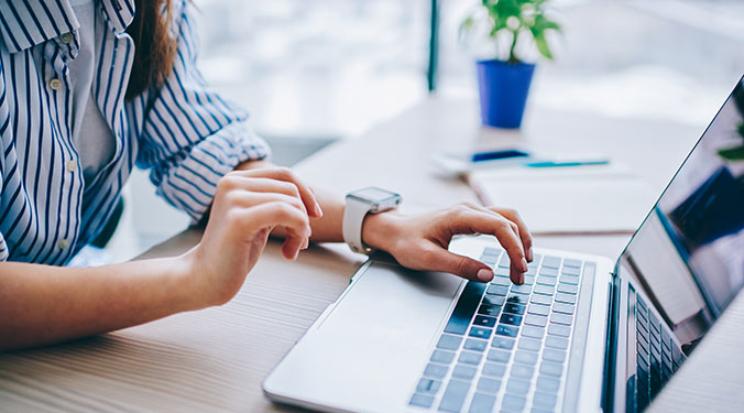 Woman searching online business for sale listings.