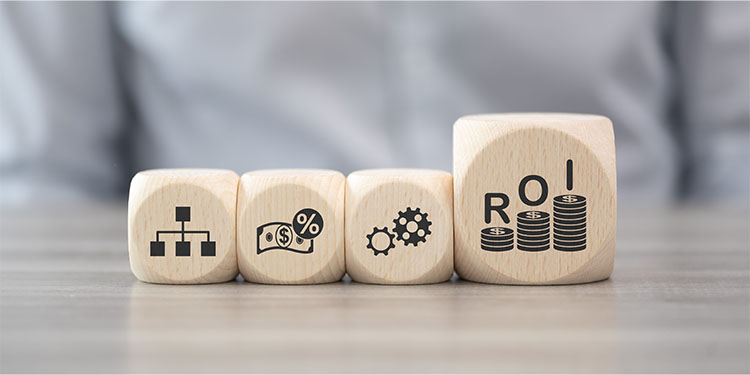 The acronym, ROI, for return on investment depicted on wooden blocks. 