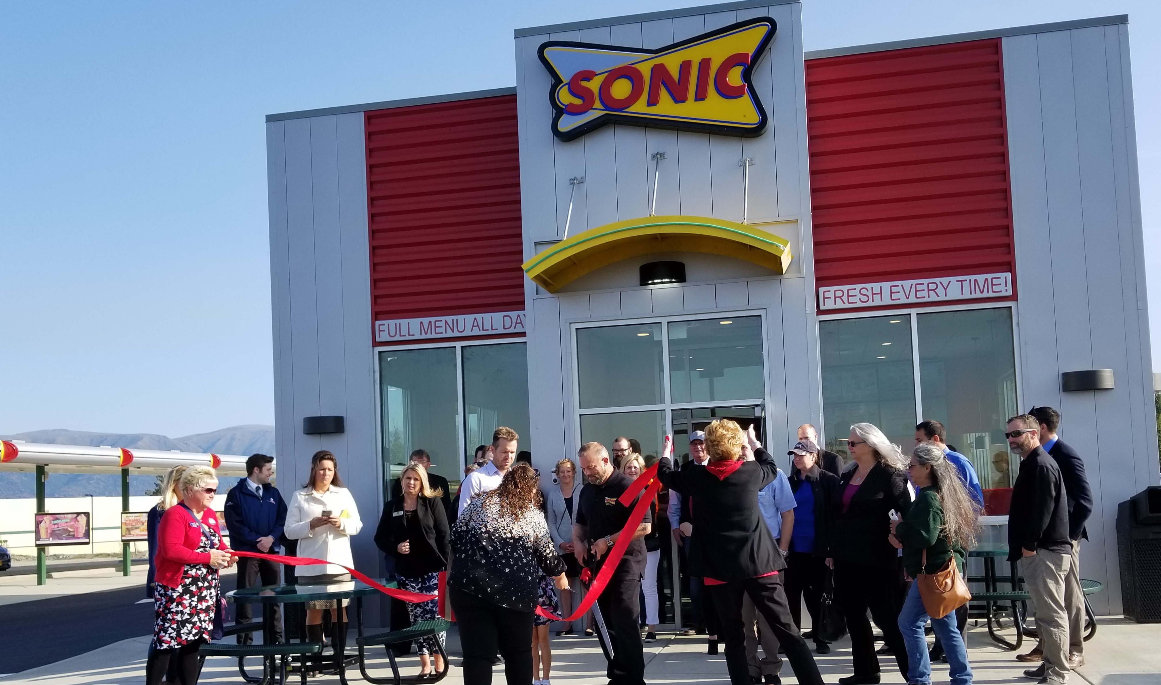 Franchisee Larry Clark cuts the ribbon on the first Sonic Drive-in in Alaska. (Courtesy of Larry Clark)