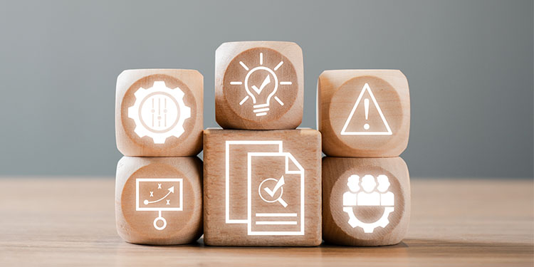 Wooden blocks depicting internal auditing for selling a business.