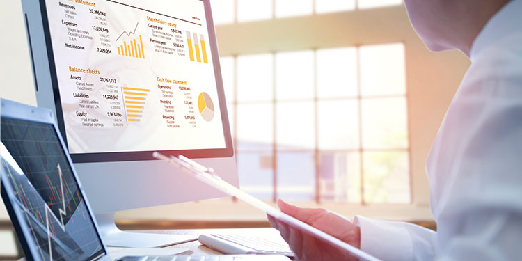 Cash flow and EBITDA valuation metrics displayed on computer screen.