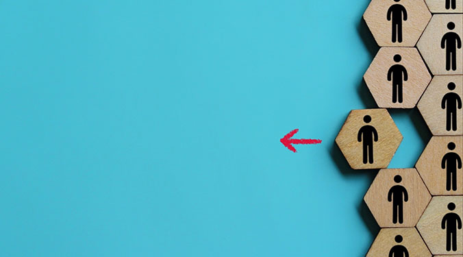 Wooden tiles depicting an employee leaving the group.