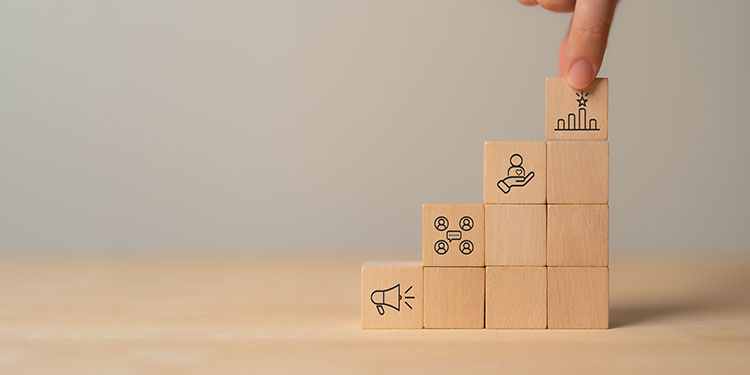 Brand recognition depicted with symbols on wooden cubes.