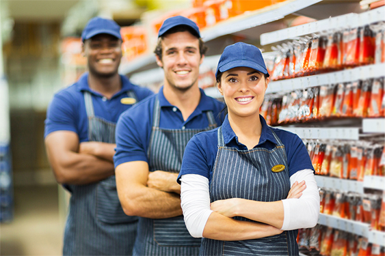 Three franchise employees working in a hardware store.