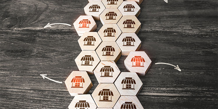 Wood tiles with franchise image, depicting a franchise sale.