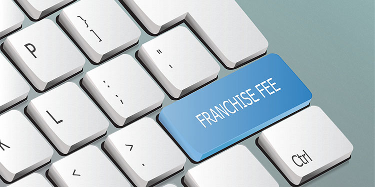 The words, "franchise fee" on key of computer keyboard.