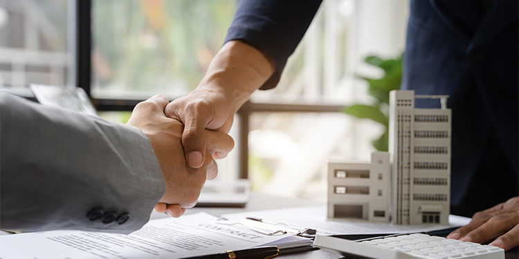 Landlord and commercial real estate tenant negotiating lease assignment.