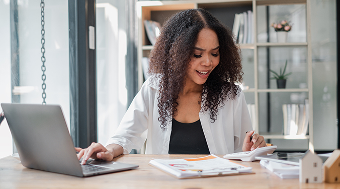 Business owner reviewing financial documents. 