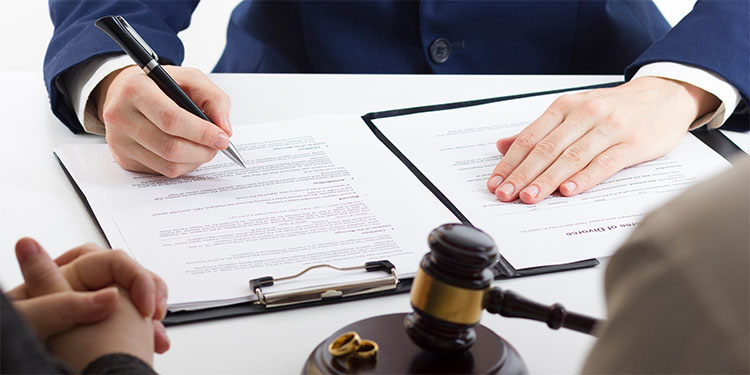 Lawyer providing guidance to a couple who are selling a business during divorce. 