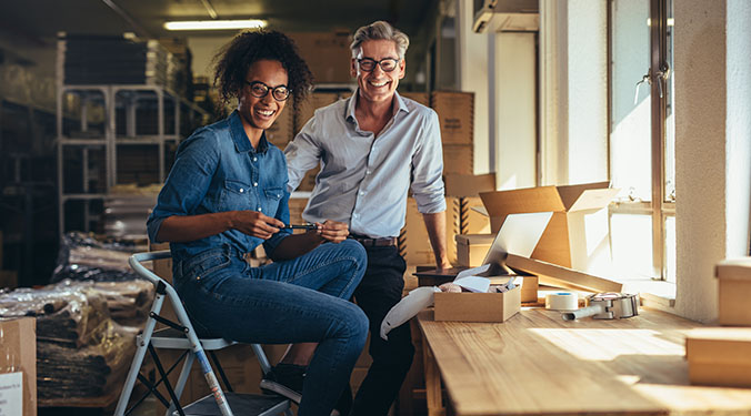 Small business owners at warehouse.