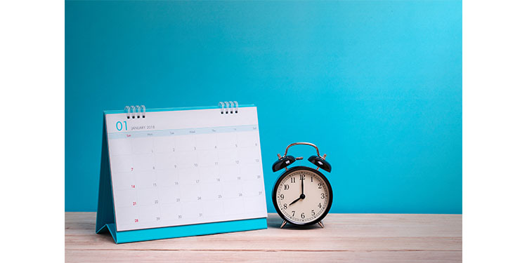 Monthly calendar and clock on blue background.