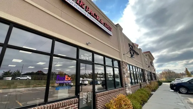 Modern store entrance highlighting the professional QPS signage and layout.