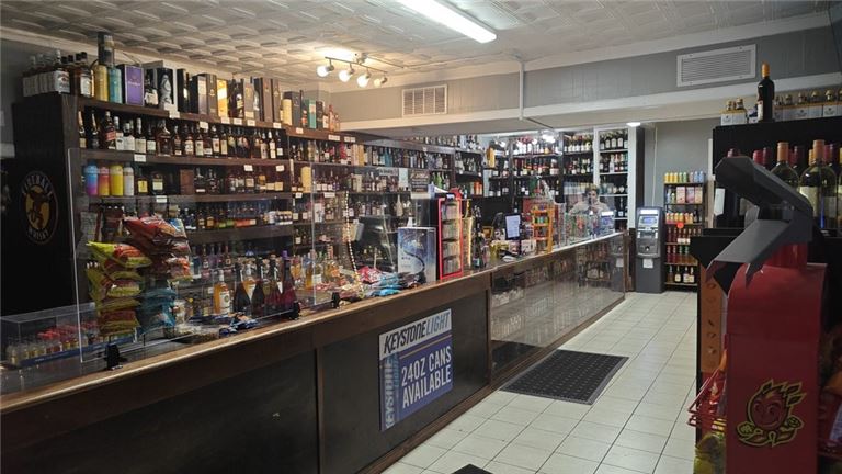 Must $63K sales Liquor, Vape & 2 Apart, with land price down $949,500
