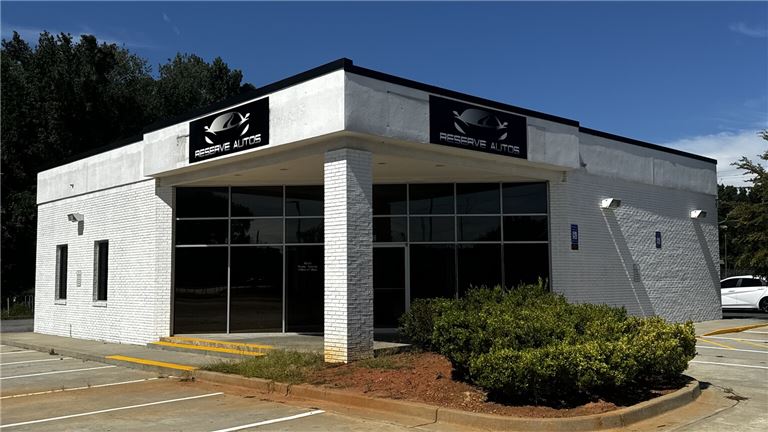 Pre-Owned Auto Dealership Location with RE