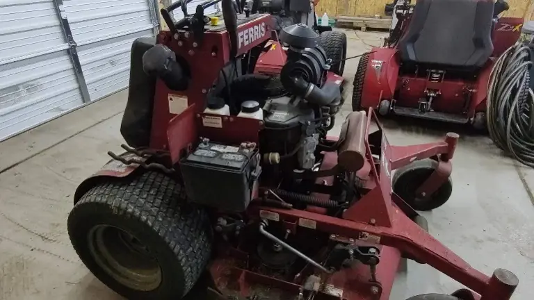 Has foot actuated grass flap to open and close grass chute on the fly