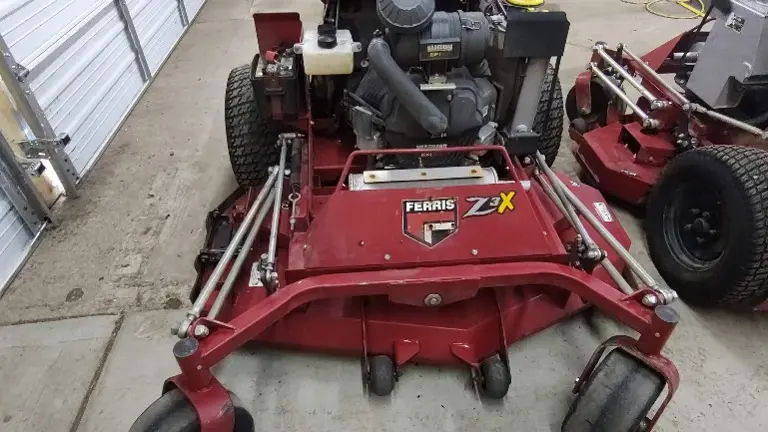 Has foot actuated grass flap to open and close grass chute on the fly