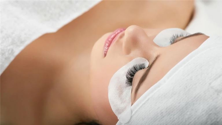 Girl Getting Eye Lashes Enlarged