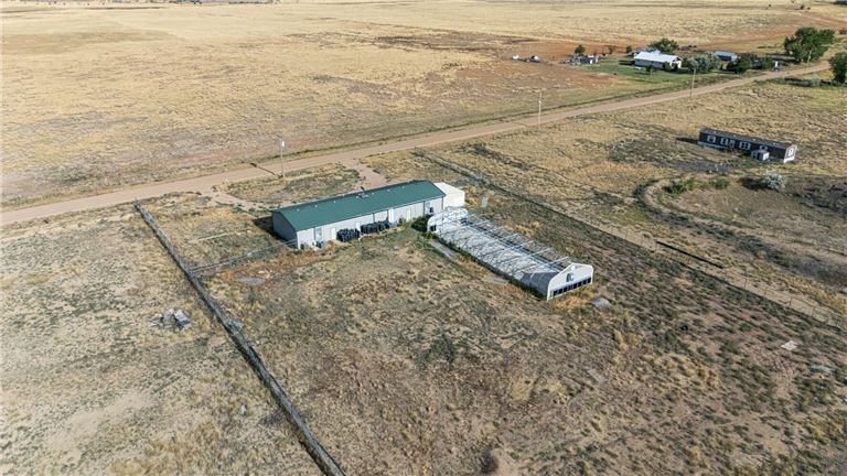 Prime Multi-Use Property: Steel Facility, Greenhouse, and 35+ Acres