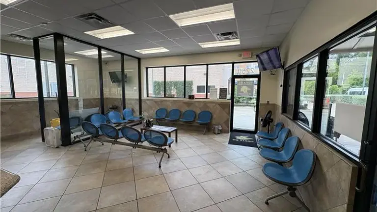Large waiting room with TVs