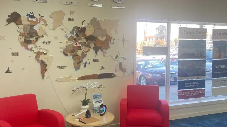 World Map Wall with Clocks and Lounge Seating Description: Inviting lounge space with global décor, including a stylized world map and international time zone 