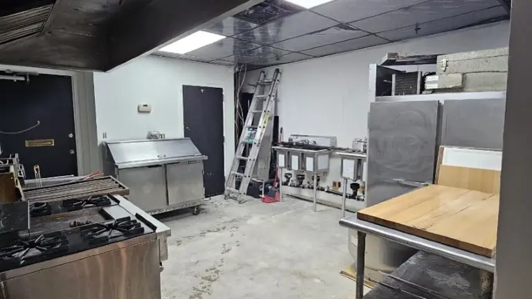 Kitchen equipment view (hood + prep area)