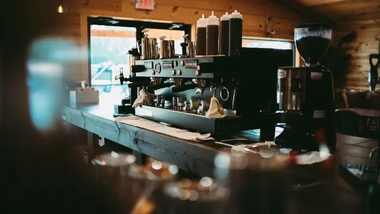 Profitable Specialty Coffee Roastery & Café Chain with Community Focus
