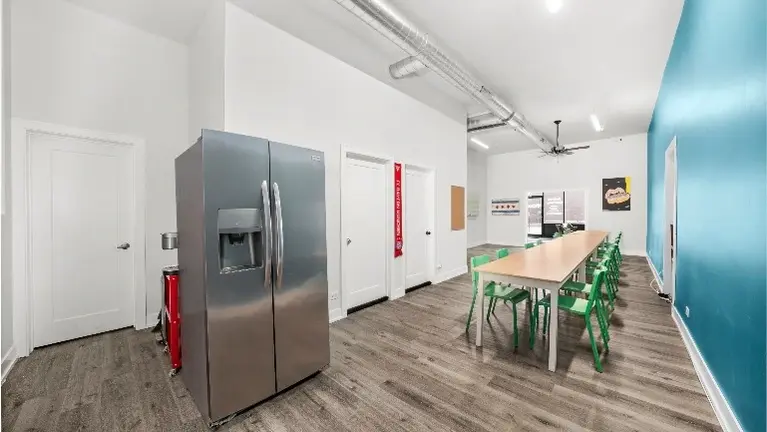 Backroom with full fridge and freezer