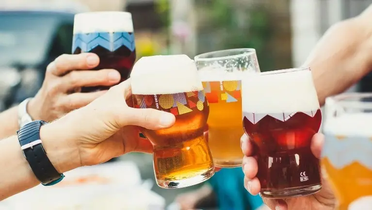 Friends raising a beer toast